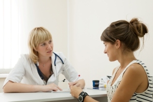 Woman doctor and patient in clinic